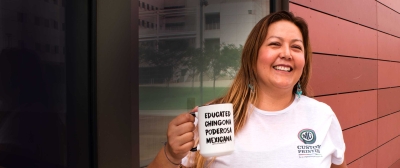 Maritza Gomez headshot with Mug