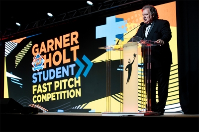 Garner Holt introducing the Fast Pitch Competition